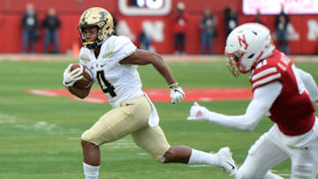 LINCOLN, NE - SEPTEMBER 29: Wide receiver Rondale Moore #4 of the Purdue Boilermakers runs from defensive back Deontai Williams #41 of the Nebraska Cornhuskers in the first half at Memorial Stadium on September 29, 2018 in Lincoln, Nebraska. (Photo by Steven Branscombe/Getty Images)