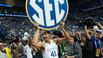Mar 15, 2015; Nashville, TN, USA; Kentucky Wildcats forward Trey Lyles (41) holds up the SEC sign after the second half of the SEC Conference championship game at Bridgestone Arena. Kentucky Wildcats defeated Arkansas Razorbacks 78-63. Mandatory Credit: Joshua Lindsey-USA TODAY Sports