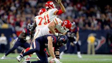 Jan 9, 2016; Houston, TX, USA; Kansas City Chiefs tackle Eric Fisher (72) battles Houston Texans defensive end J.J. Watt (99) during the third quarter in a AFC Wild Card playoff football game at NRG Stadium. Mandatory Credit: Troy Taormina-USA TODAY Sports