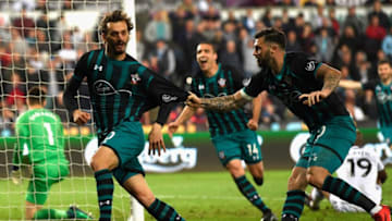 SWANSEA, WALES - MAY 08: Manolo Gabbiadini of Southampton celebrates with Charlie Austin after he scores his sides first goal during the Premier League match between Swansea City and Southampton at Liberty Stadium on May 8, 2018 in Swansea, Wales. (Photo by Stu Forster/Getty Images)