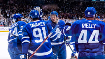 TORONTO, ON - NOVEMBER 30: John Tavares #91 of the Toronto Maple Leafs is congratulated by teammate Zach Hyman #11 after scoring the over time winner against the Buffalo Sabres at the Scotiabank Arena on November 30, 2019 in Toronto, Ontario, Canada. (Photo by Mark Blinch/NHLI via Getty Images)