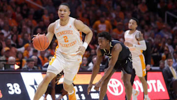 KNOXVILLE, TN - FEBRUARY 19: Grant Williams #2 of the Tennessee Volunteers dribbles past Saben Lee #0 of the Vanderbilt Commodores during their game at Thompson-Boling Arena on February 19, 2019 in Knoxville, Tennessee. Tennessee won the game 58-46. (Photo by Donald Page/Getty Images)