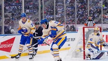 Mar 13, 2022; Hamilton, Ontario, CAN; Buffalo Sabres defenseman Mark Pysyk (13) clears the puck during the second period in the 2022 Heritage Classic ice hockey game at Tim Hortons Field. Mandatory Credit: John E. Sokolowski-USA TODAY Sports