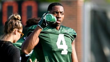 Michigan State's C.J. Hayes takes a drink during the opening day of fall camp on Thursday, Aug. 5, 2021, on the MSU campus in East Lansing.210805 Msu Fball Camp 095a