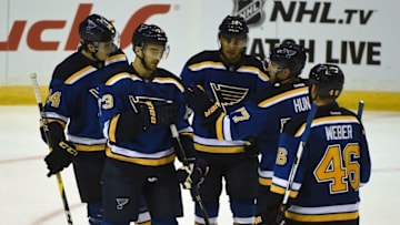 Sep 25, 2016; St. Louis, MO, USA; St. Louis Blues forward Samuel Blais (64) congratulates forward Kenny Agostino (73) after assisting on Agostino's goal. Mandatory Credit: Jeff Curry-USA TODAY Sports