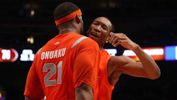 NEW YORK - NOVEMBER 20: Wes Johnson #4 and Arinze Onuaku #21 of the Syracuse Orange celebrate after defeating the North Carolina Tar Heels in the championship game of the 2K Sports Classic on November 20, 2009 at Madison Square Garden in New York City. The Orange defeated the Tar Heels 87-71 to win the championship. (Photo by Jim McIsaac/Getty Images)