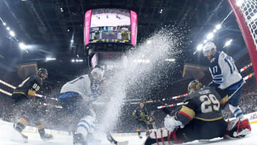 LAS VEGAS, NV - MAY 18: Marc-Andre Fleury #29 of the Vegas Golden Knights makes a save against Tyler Myers #57 and Adam Lowry #17 of the Winnipeg Jets during the first period in Game Four of the Western Conference Finals during the 2018 NHL Stanley Cup Playoffs at T-Mobile Arena on May 18, 2018 in Las Vegas, Nevada. (Photo by Harry How/Getty Images)