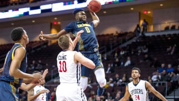 Nov 27, 2015; Las Vegas, NV, USA; California Golden Bears forward Jaylen Brown (0) flies through the air to dunk the ball while Richmond Spiders forward TJ Cline (10) defends during the first half at Orleans Arena. Mandatory Credit: Joshua Dahl-USA TODAY Sports