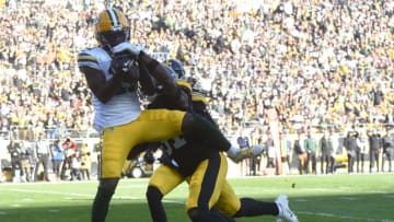 Nov 12, 2023; Pittsburgh, Pennsylvania, USA; Green Bay Packers wide receiver Jayden Reed (11) catches a touchdown for 35 yards as Pittsburgh Steelers safety Keanu Neal (31) applies coverage during the second quarter at Acrisure Stadium. Mandatory Credit: Philip G. Pavely-USA TODAY Sports