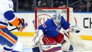 Mar 6, 2016; New York, NY, USA; New York Rangers goalie Antti Raanta (32) makes a save in front of New York Islanders left wing Josh Bailey (12) during the first period at Madison Square Garden. Mandatory Credit: Brad Penner-USA TODAY Sports