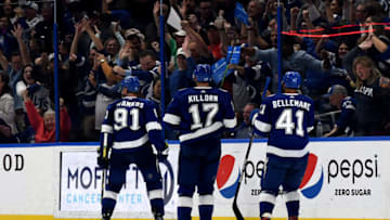 Mar 29, 2022; Tampa, Florida, USA; Tampa Bay Lightning left wing Steven Stamkos (91) celebrates after scoring the game winning goal in over time against the Carolina Hurricanes at Amalie Arena. Mandatory Credit: Jonathan Dyer-USA TODAY Sports