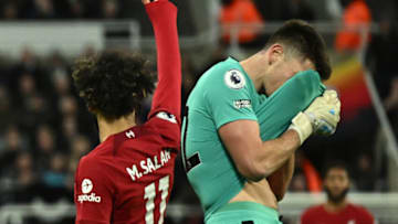 Newcastle United's English goalkeeper Nick Pope (R) reacts after receiving a red card during the English Premier League football match between Newcastle United and Liverpool at St James' Park in Newcastle-upon-Tyne, north east England on February 18, 2023. - RESTRICTED TO EDITORIAL USE. No use with unauthorized audio, video, data, fixture lists, club/league logos or 'live' services. Online in-match use limited to 120 images. An additional 40 images may be used in extra time. No video emulation. Social media in-match use limited to 120 images. An additional 40 images may be used in extra time. No use in betting publications, games or single club/league/player publications. (Photo by Oli SCARFF / AFP) / RESTRICTED TO EDITORIAL USE. No use with unauthorized audio, video, data, fixture lists, club/league logos or 'live' services. Online in-match use limited to 120 images. An additional 40 images may be used in extra time. No video emulation. Social media in-match use limited to 120 images. An additional 40 images may be used in extra time. No use in betting publications, games or single club/league/player publications. / RESTRICTED TO EDITORIAL USE. No use with unauthorized audio, video, data, fixture lists, club/league logos or 'live' services. Online in-match use limited to 120 images. An additional 40 images may be used in extra time. No video emulation. Social media in-match use limited to 120 images. An additional 40 images may be used in extra time. No use in betting publications, games or single club/league/player publications. (Photo by OLI SCARFF/AFP via Getty Images)