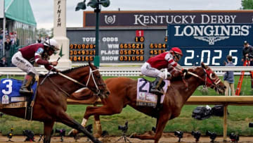 May 7, 2022; Louisville, KY, USA; Sonny Leon aboard Rich Strike wins the 148th running of the Kentucky Derby at Churchill Downs. Mandatory Credit: Peter Casey-USA TODAY Sports