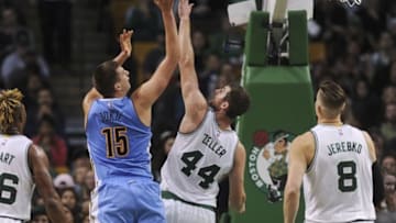 Nov 6, 2016; Boston, MA, USA; Denver Nuggets center Nikola Jokic (15) shoots the ball over Boston Celtics center Tyler Zeller (44) during the second half at TD Garden. Mandatory Credit: Bob DeChiara-USA TODAY Sports