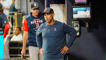 May 11, 2022; Cumberland, Georgia, USA; Boston Red Sox manager Alex Cora (13) reacts in the dugout after being ejected from the game by home plate umpire Adam Beck (102) (not shown) during the game against the Atlanta Braves during the sixth inning at Truist Park. Mandatory Credit: Dale Zanine-USA TODAY Sports