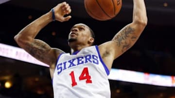 Oct 16, 2014; Philadelphia, PA, USA; Philadelphia 76ers guard K.J. McDaniels (14) scores on a dunk during the second half of a game against the Boston Celtics at Wells Fargo Center. The Celtics defeated the Sixers 111 to 91. Mandatory Credit: Bill Streicher-USA TODAY Sports