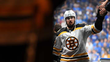ST. LOUIS, MISSOURI - JUNE 09: Marcus Johansson #90 of the Boston Bruins gets a high five from a fan as he walks back to the locker room before Game Six of the 2019 NHL Stanley Cup Final between the Boston Bruins and the St. Louis Blues at Enterprise Center on June 09, 2019 in St Louis, Missouri. (Photo by Brian Babineau/NHLI via Getty Images)