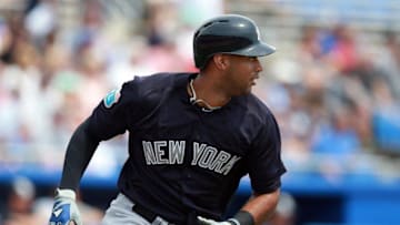 Mar 26, 2016; Dunedin, FL, USA; New York Yankees center fielder Aaron Hicks (31) hits a solo home run during the first inning against the Toronto Blue Jays at Florida Auto Exchange Park. Mandatory Credit: Kim Klement-USA TODAY Sports