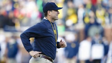 Apr 1, 2016; Ann Arbor, MI, USA; Michigan Wolverines head coach Jim Harbaugh jogs onto the field during the spring game at Michigan Stadium. Mandatory Credit: Rick Osentoski-USA TODAY Sports