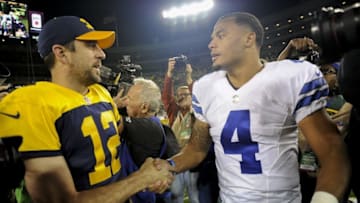 Oct 16, 2016; Green Bay, WI, USA; Green Bay Packers quarterback Aaron Rodgers (12) and Dallas Cowboys quarterback Dak Prescott (4) shake hands after thier game at Lambeau Field. Mandatory Credit: Benny Sieu-USA TODAY Sports