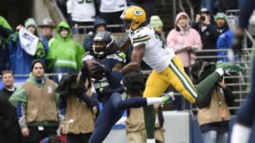 January 18, 2015; Seattle, WA, USA; Seattle Seahawks cornerback Richard Sherman (25) intercepts a pass intended for Green Bay Packers wide receiver Davante Adams (17) during the first half in the NFC Championship game at CenturyLink Field. Mandatory Credit: Kyle Terada-USA TODAY Sports