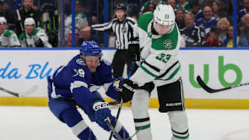 Nov 15, 2022; Tampa, Florida, USA; Tampa Bay Lightning center Ross Colton (79) and Dallas Stars defenseman Esa Lindell (23) battle for the puck in the first period at Amalie Arena. Mandatory Credit: Nathan Ray Seebeck-USA TODAY Sports