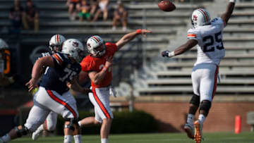 Auburn football quarterback Cord Sandberg (24) throws the ball over Auburn lineman Colby Wooden during the A-Day spring practice gameat Jordan-Hare Stadium in Auburn, Ala., on Saturday, April 13, 2019.Jc Auburnday 54