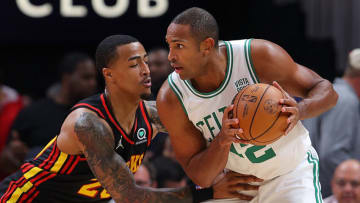ATLANTA, GEORGIA - NOVEMBER 17: John Collins #20 of the Atlanta Hawks defends Al Horford #42 of the Boston Celtics during the first half at State Farm Arena on November 17, 2021 in Atlanta, Georgia. NOTE TO USER: User expressly acknowledges and agrees that, by downloading and or using this photograph, User is consenting to the terms and conditions of the Getty Images License Agreement. (Photo by Kevin C. Cox/Getty Images)
