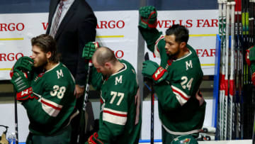 EDMONTON, ALBERTA - AUGUST 07: Matt Dumba #24 of the Minnesota Wild raises his fist during the national anthem prior to Game Four of the Western Conference Qualification Round against the Vancouver Canucks prior to the 2020 NHL Stanley Cup Playoffs at Rogers Place on August 07, 2020 in Edmonton, Alberta. (Photo by Jeff Vinnick/Getty Images)