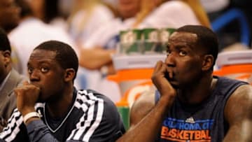 May 15, 2013; Oklahoma City, OK, USA; Oklahoma City Thunder point guard Reggie Jackson (15) and center Kendrick Perkins (5) watch the game against the Memphis Grizzlies from the bench during the second half of game five of the second round of the 2013 NBA Playoffs at Chesapeake Energy Arena. The Grizzlies defeated the Thunder 88-84. Mandatory Credit: Jerome Miron-USA TODAY Sports