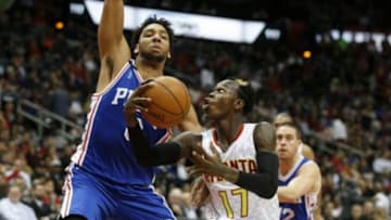 Dec 16, 2015; Atlanta, GA, USA; Atlanta Hawks guard Dennis Schroder (17) makes a move against Philadelphia 76ers center Jahlil Okafor (8) in the third quarter of their game at Philips Arena. The Hawks won 127-106. Mandatory Credit: Jason Getz-USA TODAY Sports