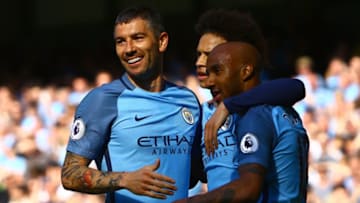 Manchester City's English midfielder Fabian Delph (R) celebrates scoring his team's third goal during the English Premier League football match between Manchester City and Hull City at the Etihad Stadium in Manchester, north west England, on April 8, 2017. / AFP PHOTO / Geoff CADDICK / RESTRICTED TO EDITORIAL USE. No use with unauthorized audio, video, data, fixture lists, club/league logos or 'live' services. Online in-match use limited to 75 images, no video emulation. No use in betting, games or single club/league/player publications. / (Photo credit should read GEOFF CADDICK/AFP/Getty Images)