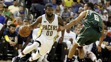 Oct 12, 2016; Evansville, IN, USA; Indiana Pacers guard Aaron Brooks (00) works past Milwaukee Bucks guard Michael Carter-Williams (5) at Ford Center. Mandatory Credit: James Brosher-USA TODAY Sports