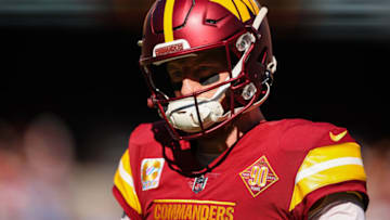 LANDOVER, MD - OCTOBER 09: Carson Wentz #11 of the Washington Commanders looks on against the Tennessee Titans during the second half of the game at FedExField on October 9, 2022 in Landover, Maryland. (Photo by Scott Taetsch/Getty Images)