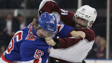 NEW YORK, NEW YORK - JANUARY 07: Ryan Lindgren #55 of the New York Rangers fights with Nazem Kadri #91 of the Colorado Avalanche during the first period at Madison Square Garden on January 07, 2020 in New York City. The Rangers defeated the Avalanche 5-3. (Photo by Bruce Bennett/Getty Images)
