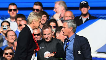 LONDON, ENGLAND - OCTOBER 05: Fourth Official Jonathan Moss comes between Managers Arsene Wenger of Arsenal and Jose Mourinho manager of Chelsea during the Barclays Premier League match between Chelsea and Arsenal at Stamford Bridge on October 4, 2014 in London, England. (Photo by Shaun Botterill/Getty Images)