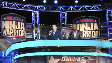 AMERICAN NINJA WARRIOR -- "Dallas Qualifiers" Episode 1002 -- Pictured: (l-r) Matt Iseman, Akbar Gbajabiamila -- (Photo by: Cooper Neill/NBC/NBCU Photo Bank via Getty Images)