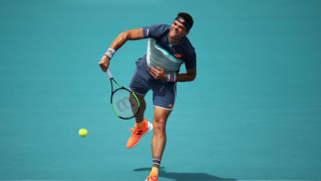 MIAMI GARDENS, FLORIDA - MARCH 24: Milos Raonic of Canada in action against Kyle Edmund of Great Britain during day seven at the Miami Open Tennis on March 24, 2019 in Miami Gardens, Florida. (Photo by Julian Finney/Getty Images)