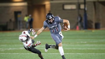 Auburn footballBenedictine quarterback Holden Geriner stiff-arms North Oconee's Rodrick Finch to the ground in a state semifinal win on Dec. 3 at Memorial Stadium.
