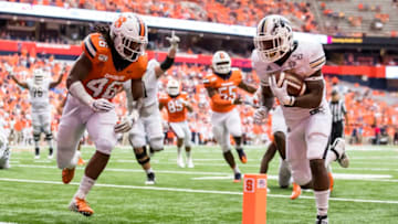 SYRACUSE, NY - SEPTEMBER 21: Sean Tyler #28 of the Western Michigan Broncos scores a touchdown during the third quarter against Lakiem Williams #46 of the Syracuse Orange at the Carrier Dome on September 21, 2019 in Syracuse, New York. Syracuse defeats Western Michigan 52-33. (Photo by Brett Carlsen/Getty Images)