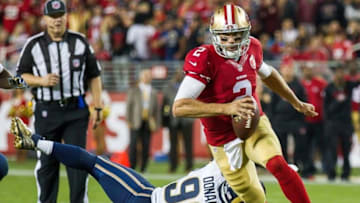 Sep 12, 2016; Santa Clara, CA, USA; San Francisco 49ers quarterback Blaine Gabbert (2) runs against Los Angeles Rams defensive tackle Aaron Donald (99) during the second quarter at Lev'i's Stadium. Mandatory Credit: Kelley L Cox-USA TODAY Sports