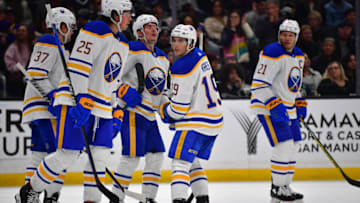 Feb 13, 2023; Los Angeles, California, USA; Buffalo Sabres center Peyton Krebs (19) celebrates his goal scored against the Los Angeles Kings with defenseman Owen Power (25) and center Casey Mittelstadt (37) during the third period at Crypto.com Arena. Mandatory Credit: Gary A. Vasquez-USA TODAY Sports