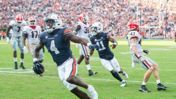 Auburn football running back Tank Bigsby (4) celebrates his touchdown run against Georgia at Jordan-Hare Stadium in Auburn, Ala., on Saturday, Oct. 9, 2021.