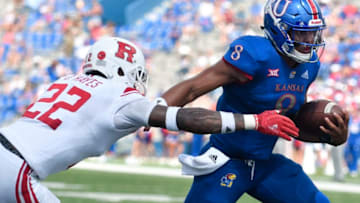 LAWRENCE, KS - SEPTEMBER 15: Quarterback Miles Kendrick #8 of the Kansas Jayhawks gets past defensive back Damon Hayes #22 of the Rutgers Scarlet Knights as he runs for an eight yard touchdown in the third quarter at Memorial Stadium on September 15, 2018 in Lawrence, Kansas. (Photo by Ed Zurga/Getty Images)
