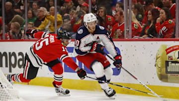 CHICAGO, IL - SEPTEMBER 23: Alexander Wennberg #10 of the Columbus Blue Jackets is pressured by Artem Anisimov #15 of the Chicago Blackhawks during a preseason game at the United Center on September 23, 2017 in Chicago, Illinois. (Photo by Jonathan Daniel/Getty Images)