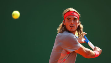 MONTE-CARLO, MONACO - APRIL 18: Stefanos Tsitsipas of Greece plays a backhand against Daniil Medvedev of Russia in their third round match during day five of the Rolex Monte-Carlo Masters at Monte-Carlo Country Club on April 18, 2019 in Monte-Carlo, Monaco. (Photo by Clive Brunskill/Getty Images)