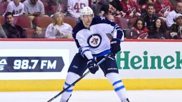 Nov 10, 2016; Glendale, AZ, USA; Winnipeg Jets defenseman Paul Postma (4) carries the puck during the second period against the Arizona Coyotes at Gila River Arena. Mandatory Credit: Matt Kartozian-USA TODAY Sports