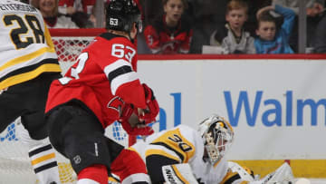 NEWARK, NEW JERSEY - FEBRUARY 19: Matt Murray #30 of the Pittsburgh Penguins makes the first period save as Jesper Bratt #63 of the New Jersey Devils looks for the rebound at the Prudential Center on February 19, 2019 in Newark, New Jersey. (Photo by Bruce Bennett/Getty Images)