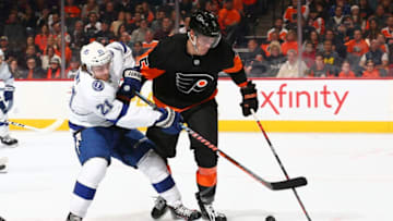 PHILADELPHIA, PA - JANUARY 11: Brayden Point #21 of the Tampa Bay Lightning battles for the puck against Philippe Myers #5 of the Philadelphia Flyers in the second period at the Wells Fargo Center on January 11, 2020 in Philadelphia, Pennsylvania. (Photo by Mitchell Leff/Getty Images)