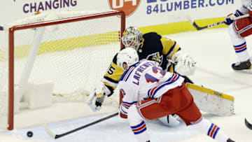 Jan 24, 2021; Pittsburgh, Pennsylvania, USA; New York Rangers left wing Alexis Lafreniere (13) attempts a shot on goal against Pittsburgh Penguins goaltender Tristan Jarry (35) during the first period at the PPG Paints Arena. Mandatory Credit: Charles LeClaire-USA TODAY Sports